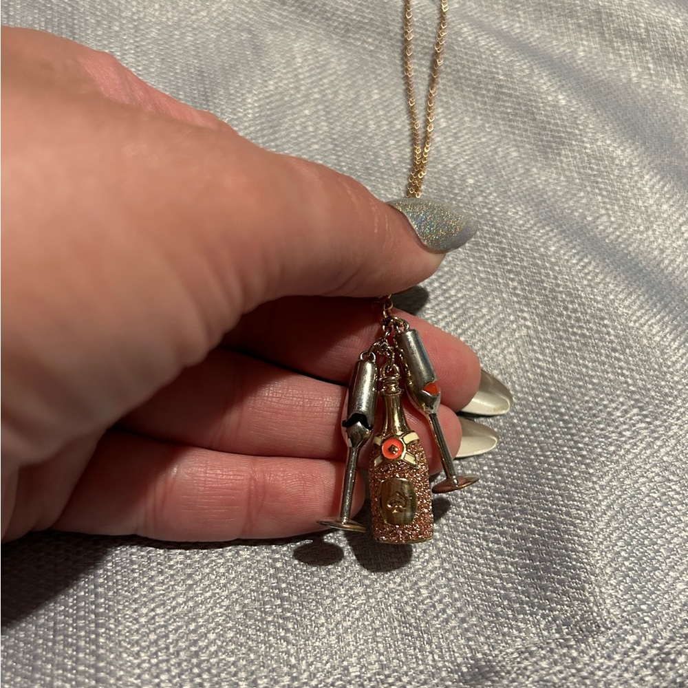 Kate Spade champagne bottle necklace, rose gold.
